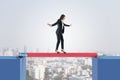 Attractive european business woman crossing pencil bridge on sky background. Career problem and gap concept Royalty Free Stock Photo