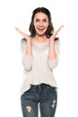 Attractive excited woman standing in casual clothes