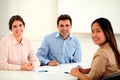 Attractive executive ethnic group smiling at you Royalty Free Stock Photo