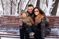 Attractive family in a winter park Royalty Free Stock Photo