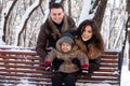 Attractive family in a winter park Royalty Free Stock Photo