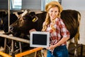 attractive farmer in straw hat showing blackboard Royalty Free Stock Photo