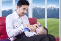 Attractive father replace his baby wear