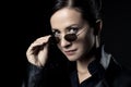 Attractive female agent in black leather coat Royalty Free Stock Photo