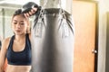 Attractive female boxer training with kick boxing at gym with blackgloves Royalty Free Stock Photo