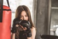 Attractive female boxer training with kick boxing at gym with blackgloves Royalty Free Stock Photo