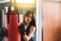 Attractive female boxer training with kick boxing at gym with blackgloves Royalty Free Stock Photo