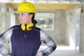 Attractive female builder with ear protection gear