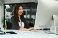 Attractive female customer service representatives wearing headset working on support hotline in modern workplace Royalty Free Stock Photo