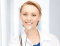 Attractive female dentist with tools Royalty Free Stock Photo