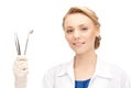 Attractive female dentist with tools Royalty Free Stock Photo