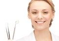 Attractive female dentist with tools Royalty Free Stock Photo