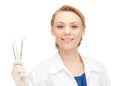 Attractive female dentist with tools Royalty Free Stock Photo