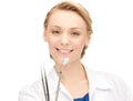 Attractive female dentist with tools Royalty Free Stock Photo