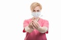 Attractive female dentist wearing scrubs showing tools