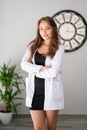 A attractive female dietician doctor looking with, confidence and pretty smile.