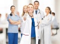 Attractive female doctor pointing her finger Royalty Free Stock Photo