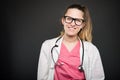 Attractive female doctor portrait smiling wearing glasses Royalty Free Stock Photo