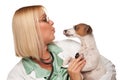 Attractive Female Doctor Veterinarian with Puppy