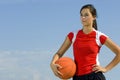 Attractive female holding a basketball