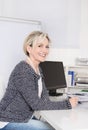 Attractive female manager in portrait smiling at camera. Royalty Free Stock Photo