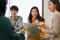 Attractive female mobile application designer sharing her ideas to her team during the meeting Royalty Free Stock Photo