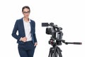 attractive female newscaster standing in front of camera,