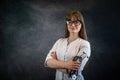 attractive female nurse or intern in white medical uniform with stethoscope, isolated on dark Royalty Free Stock Photo