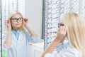 attractive female ophthalmologist wearing glasses while standing