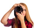 Attractive female photographer holding a professional camera - i