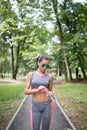 Young woman exercising in city park