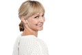 Attractive female turning back and smiling at you Royalty Free Stock Photo