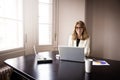 Attractive financial businesswoman working on her laptop in the office Royalty Free Stock Photo