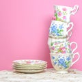 Attractive fine bone china tea cups on pink background Royalty Free Stock Photo