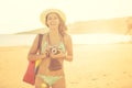 Attractive fit trendy modern hipster woman taking photos with retro vintage film camera.Lifestyle photographer Royalty Free Stock Photo