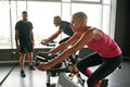 Attractive fit woman excercising on gym bike Royalty Free Stock Photo