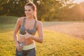 Attractive fitness woman in sport clothes gesturing thumbs up Royalty Free Stock Photo