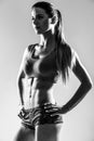 Attractive fitness woman, trained female body.