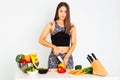 Attractive fitness woman, trained female Fit power athletic confident young woman bodybuilder cuting orange, Organic Food.