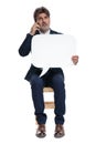 Formal businessman sitting and talking on the mobile phone