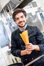 Attractive friendly chef preparing spaghetti