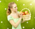 Attractive girl with basket of apples Royalty Free Stock Photo