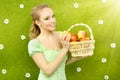 Attractive girl with a basket of apples Royalty Free Stock Photo
