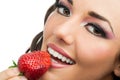 Attractive girl eating strawberry. Royalty Free Stock Photo