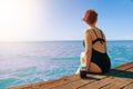 Attractive girl enjoys sea view on vacation. Royalty Free Stock Photo