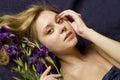 Attractive girl with flowers iris Royalty Free Stock Photo