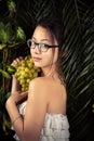 Attractive girl with grapes closeup