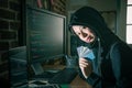Attractive girl hacker stealing many credit card