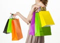 Attractive girl holding multicolored shopping paper bags Royalty Free Stock Photo