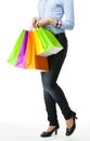 Attractive girl holding multicolored shopping paper bags Royalty Free Stock Photo